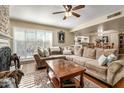 Cozy living room features a large sofa, fireplace, and natural light from the window at 8082 E Via Del Vencino --, Scottsdale, AZ 85258