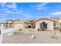Charming home with desert landscaping, light-colored stucco, and a tile roof at 8096 E Lavender Dr, Gold Canyon, AZ 85118