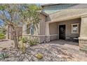 Inviting front porch with seating area and decorative wreath on the front door at 1432 E Pedro Rd, Phoenix, AZ 85042