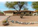 Charming single-story home featuring desert landscaping and a two-car garage at 14418 N San Carlos Dr, Fountain Hills, AZ 85268