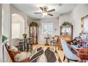 Cozy living room with a ceiling fan, neutral walls, and elegant decorative elements at 16875 W Manchester Dr, Surprise, AZ 85374
