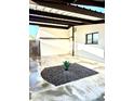 This carport features black rock landscaping and a succulent planter to add character at 7754 W Mitchell Dr, Phoenix, AZ 85033
