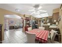 Eat-in kitchen with tiled flooring, stainless steel appliances, and plenty of natural light with a breakfast nook at 7906 E Naranja Ave, Mesa, AZ 85209