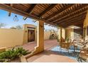 Inviting outdoor patio featuring a wooden pergola, fireplace, and ample seating for entertaining at 8821 N 9Th Ave, Phoenix, AZ 85021