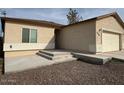 Cozy single-story home featuring a two car garage and desert landscaping at 9408 W Jackson St, Tolleson, AZ 85353