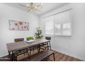 Bright dining area features modern light fixture and a large window, creating an inviting space at 1226 E Fairmont Dr, Tempe, AZ 85282