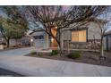 Charming home exterior featuring stone accents, desert landscaping and covered entryway at 21255 W Ashland Ave, Buckeye, AZ 85396