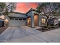 Charming home exterior featuring stone accents, desert landscaping and covered entryway at 21255 W Ashland Ave, Buckeye, AZ 85396