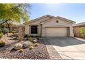 Charming single-story home featuring desert landscaping, a two-car garage, and an inviting facade at 2951 W Plum Hollow Dr, Anthem, AZ 85086
