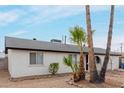 Charming single-story home featuring desert landscaping and well-maintained sidewalks at 3217 E Friess Dr, Phoenix, AZ 85032