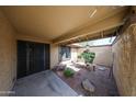 Cozy courtyard featuring desert landscaping, decorative stone, a small bench, and access to the home at 4916 E Hopi St, Phoenix, AZ 85044