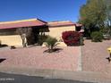 Charming single-story home with well-maintained landscaping, including desert foliage and decorative rock at 4916 E Hopi St, Phoenix, AZ 85044