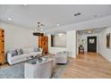 Bright living room featuring hardwood floors, comfortable seating, and natural light at 5112 N 41St St, Phoenix, AZ 85018
