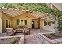 Inviting outdoor patio with comfortable seating and a cozy fireplace feature at 5112 N 41St St, Phoenix, AZ 85018