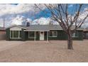 Charming single-story home with a well-maintained front yard, featuring a classic design and desert landscaping at 6119 N 18Th Dr, Phoenix, AZ 85015