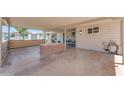 Spacious covered carport featuring a brick BBQ, ceiling fans, and plenty of room for outdoor entertaining at 6943 E Granada Rd, Scottsdale, AZ 85257