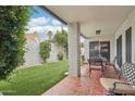 Charming outdoor space with a covered patio and a well-manicured lawn, perfect for relaxation at 9155 N 107Th St, Scottsdale, AZ 85258