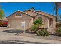 Inviting home showcasing desert landscaping, a two-car garage, and easy access at 9922 E Onza Ave, Mesa, AZ 85212