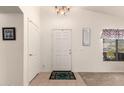 Welcoming entryway with neutral tones, a decorative rug, and natural light at 1297 E Maddison St, San Tan Valley, AZ 85140