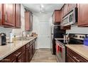 Efficient kitchen featuring stainless steel appliances, granite countertops, and ample cabinet space at 14145 N 92Nd St # 1031, Scottsdale, AZ 85260