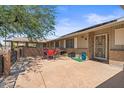 Outdoor patio with red dining set, brick accents, privacy wall, and access to the house at 14633 N Boswell Blvd, Sun City, AZ 85351