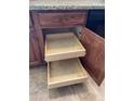 Custom kitchen cabinets with pull-out shelves offer easy access and organized storage solutions at 16423 N 41St Pl, Phoenix, AZ 85032