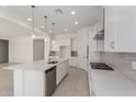 Spacious kitchen with a large island, stainless steel appliances, and ample counter space at 21640 E Roundup Way, Queen Creek, AZ 85142