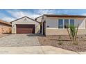 Attractive home with a brick driveway, a well-kept yard, and a two-car garage at 25215 N 131St Dr, Peoria, AZ 85383