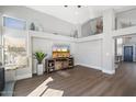 Cozy living room featuring hardwood floors, a fireplace nook, and lots of natural light at 4805 E Monte Cristo Ave, Scottsdale, AZ 85254