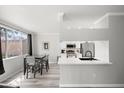 Bright dining area adjacent to kitchen, complemented by modern fixtures and ample natural light at 5345 E Van Buren St # 141, Phoenix, AZ 85008