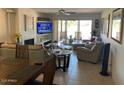 Cozy living room features a fireplace, neutral tones, and sliding doors to a patio, creating a relaxing space at 7348 N Via Camello Del Norte -- # 223, Scottsdale, AZ 85258