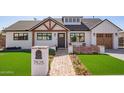 Charming home featuring a walkway, manicured landscaping, and welcoming front yard at 7525 E Latham St, Scottsdale, AZ 85257