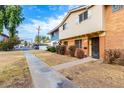 Charming townhome exterior with a walkway, showcasing its curb appeal and inviting entrance at 1578 W Campbell Ave, Phoenix, AZ 85015