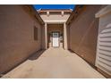 A covered walkway leads to the home's front entrance, offering a welcoming approach at 18750 E Ryan Rd, Queen Creek, AZ 85142