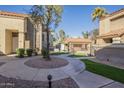 Charming condo community showcasing well-maintained walkways, manicured landscaping, and inviting common spaces at 1905 E University Dr # 219, Tempe, AZ 85288