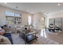 Inviting living area with a modern sofa, chic decor, and seamless flow to the dining area at 2121 W Sonoran Desert Dr # 41, Phoenix, AZ 85085