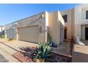 Charming home featuring a two-car garage, desert landscaping, and inviting curb appeal at 2331 E Evans Dr, Phoenix, AZ 85022