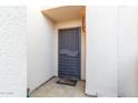 The property has a secure front door, along with tile flooring and outdoor lighting at 2331 E Evans Dr, Phoenix, AZ 85022