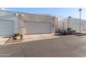 Exterior shot of property featuring a two-car garage with an extended driveway at 2331 E Evans Dr, Phoenix, AZ 85022