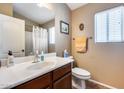 Cozy bathroom with a single sink vanity and shower at 24204 N 27Th Pl, Phoenix, AZ 85024