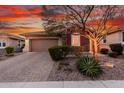 Charming single-story home with stone accents, desert landscaping, and a two-car garage at 30816 N 138Th Ave, Peoria, AZ 85383