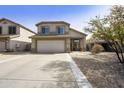 Charming two-story home featuring a spacious driveway and low-maintenance desert landscaping at 4439 E Coyote Wash Dr, Cave Creek, AZ 85331