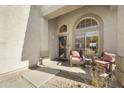 Inviting covered front porch with seating area and decorative security screen door at 4439 E Coyote Wash Dr, Cave Creek, AZ 85331