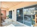 Relaxing balcony with sliding glass doors, string lights, and outdoor seating, perfect for enjoying the fresh air at 540 N May -- # 2151, Mesa, AZ 85201