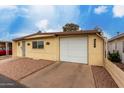 Charming single-story home with attached garage, desert landscaping, and security door at 6830 W Mckinley St, Phoenix, AZ 85043