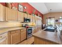 Well-equipped kitchen with stainless steel appliances, ample counter space, and wood cabinets offering storage and style at 8212 E Masters Rd, Gold Canyon, AZ 85118