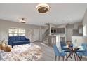 A spacious living room has stylish furnishings and decor, creating an inviting and comfortable atmosphere at 9621 N 82Nd Ln, Peoria, AZ 85345