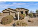 Inviting single-story home with well-maintained desert landscaping, and a welcoming front entrance at 13121 S 178Th Ave, Goodyear, AZ 85338