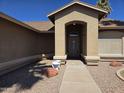 Welcoming front entrance showcasing a covered porch and pathway at 1688 E Krystal St, Casa Grande, AZ 85122