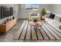 Bright living room with stylish furniture, decor, and a large window that provides plenty of natural light at 3009 W Laurel Ln, Phoenix, AZ 85029